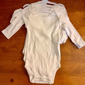 3 New White Carter’s Long-Sleeve Bodysuits (6 months)
